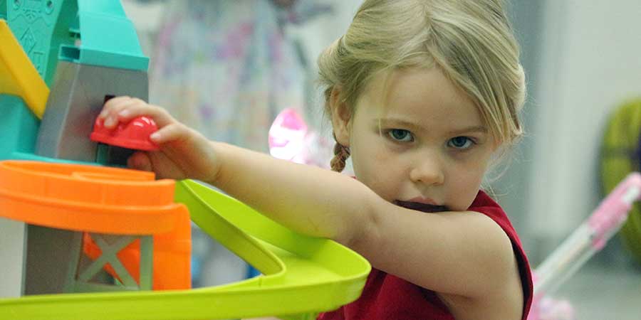 toddler playing with toy